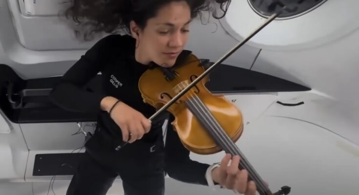 SpaceX astronaut Sarah Gillis performing "Rey's Theme" from "Star Wars: The Force Awakens" on her violin. Photo: Space Intelligence via https://youtu.be/lD1ixTr4JWY?si=zJbzpWzM839G8b4j